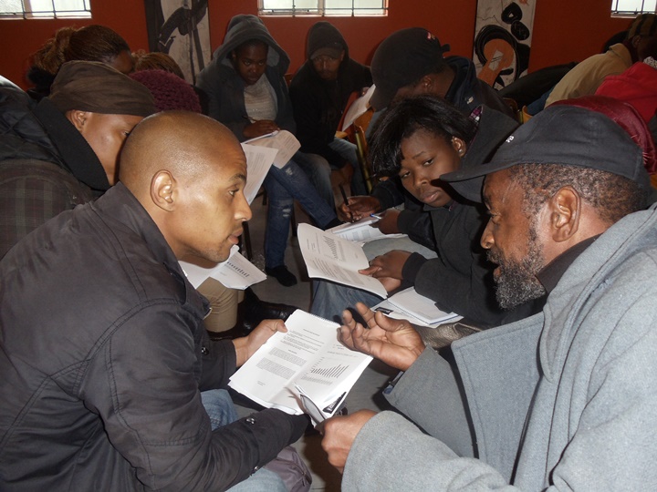 Participants engaging with each other on various topics in the Think Global Act Local workshop